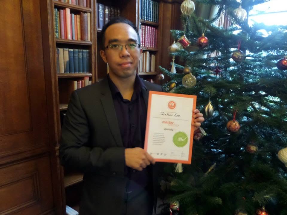 Jenkin Lee holding his Master Trainer certificate in 2014